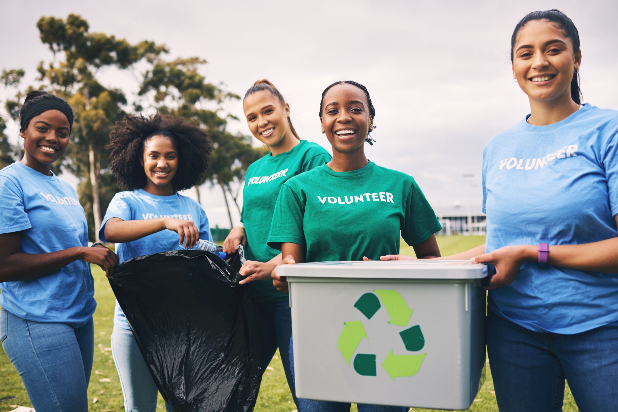 A group of women volunteering outside.