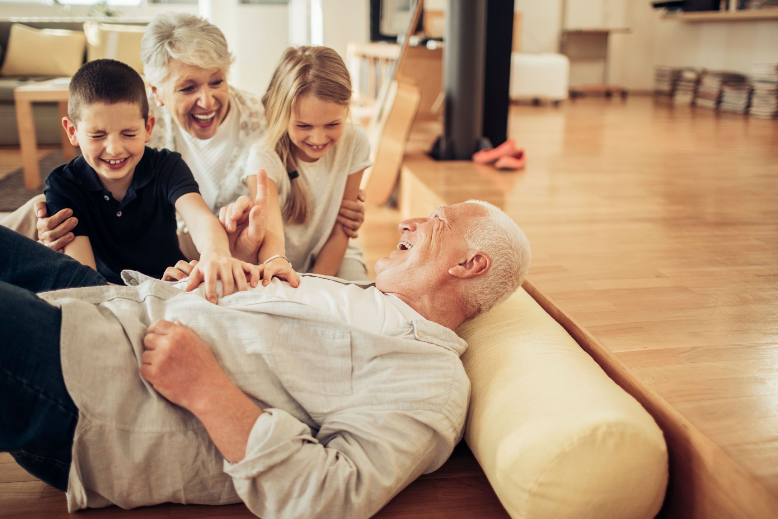 Grandparents playing with their grandchildren.